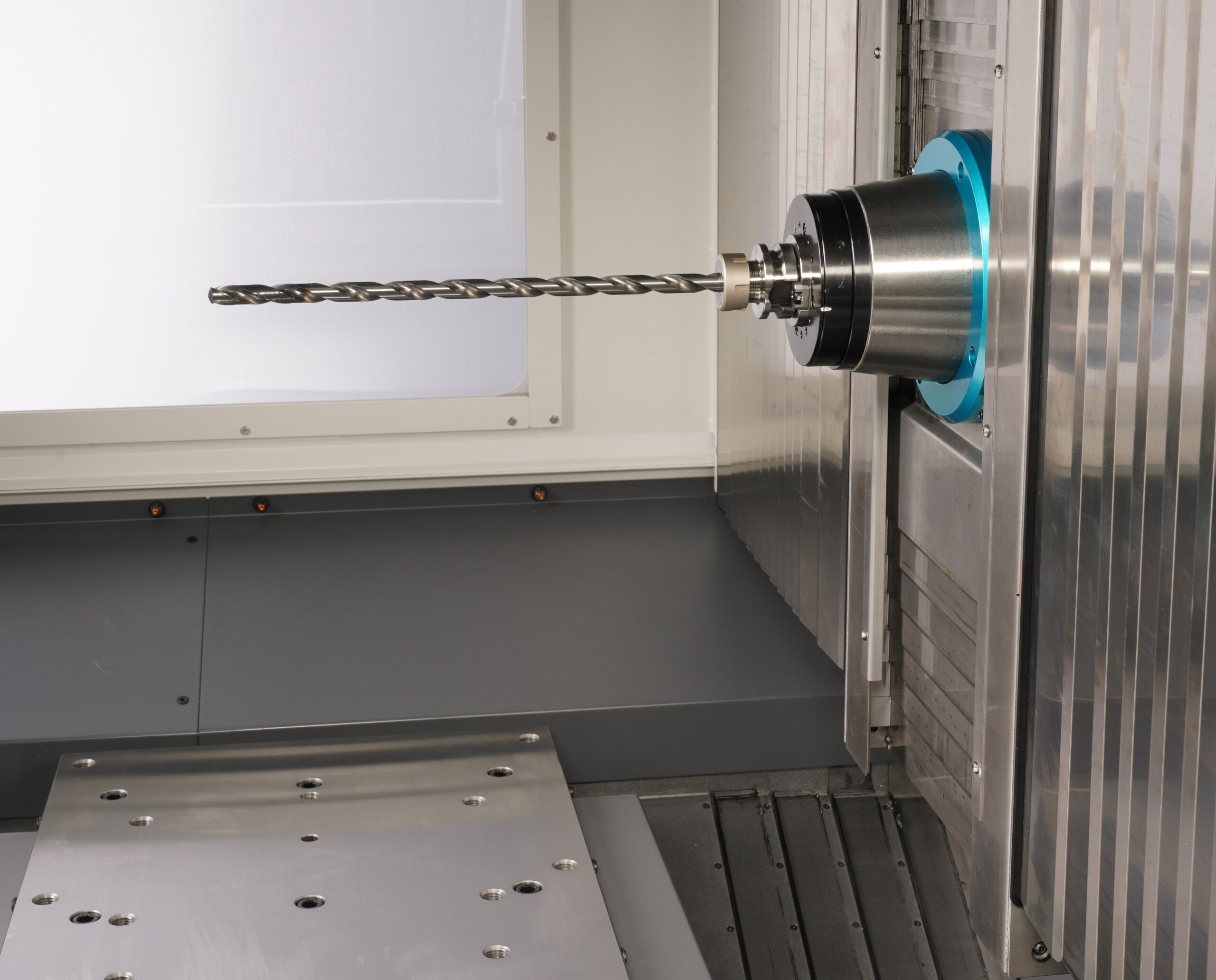 Spindle with long tool for precision deep hole drilling